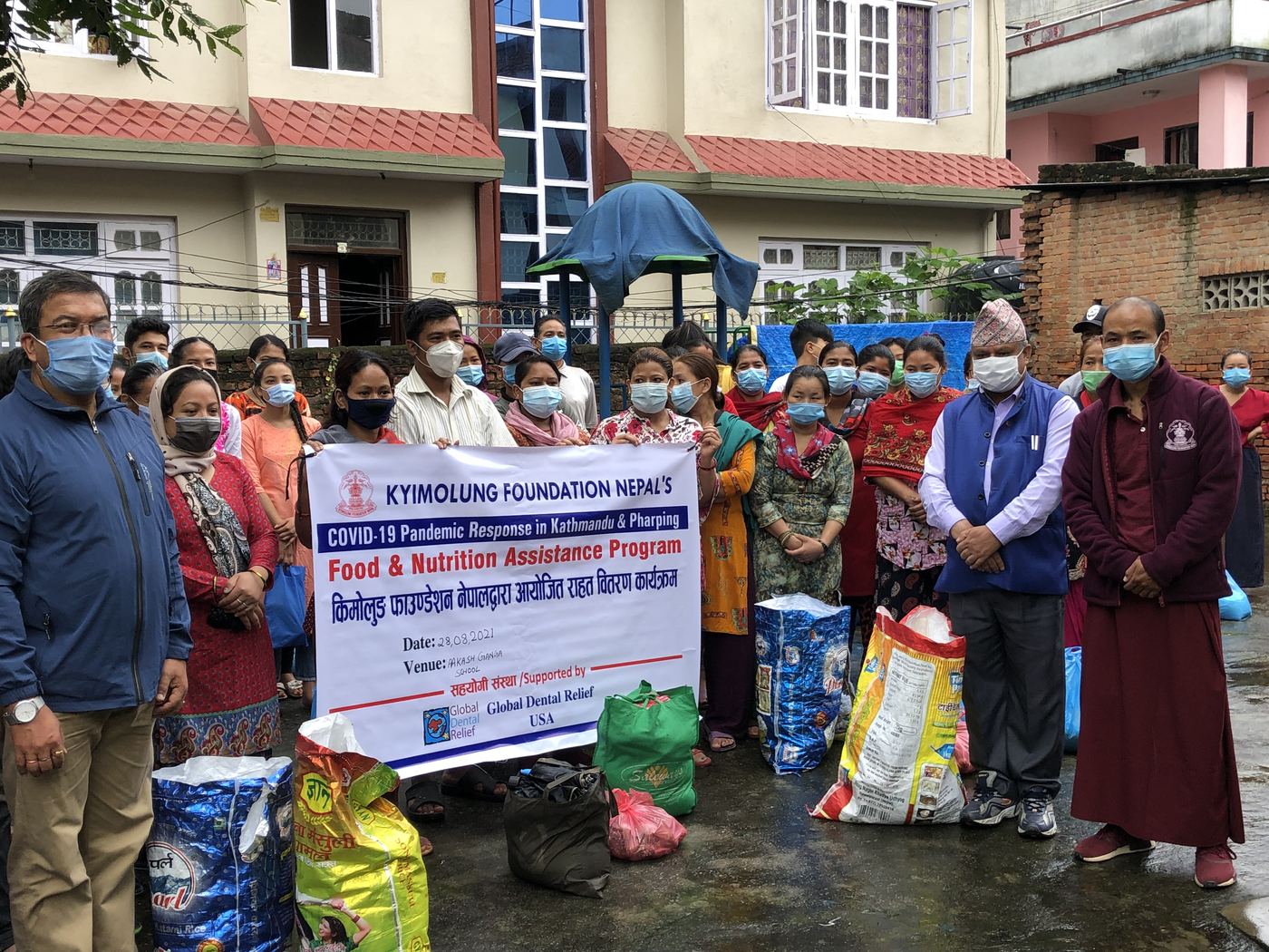 Families and volunteers at a food and nutrition assistance distribution in Kathmandu during the COVID-19 pandemic