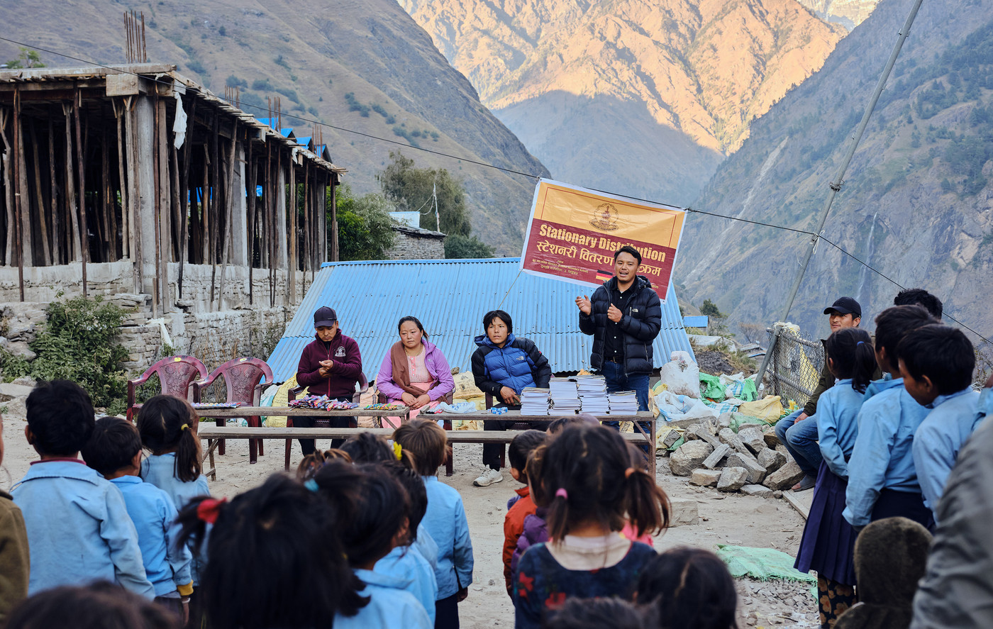 Schoolchildren in a mountain village at a stationery distribution by Kyimolung Foundation Nepal